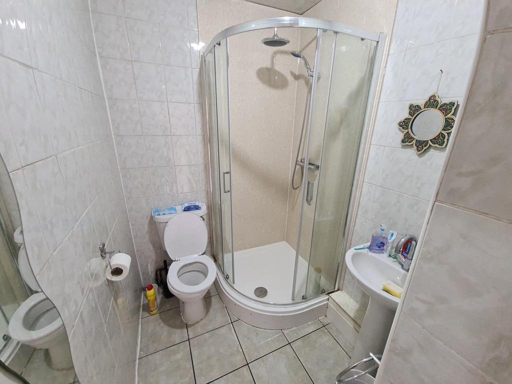 A clean and well-maintained bathroom featuring ...