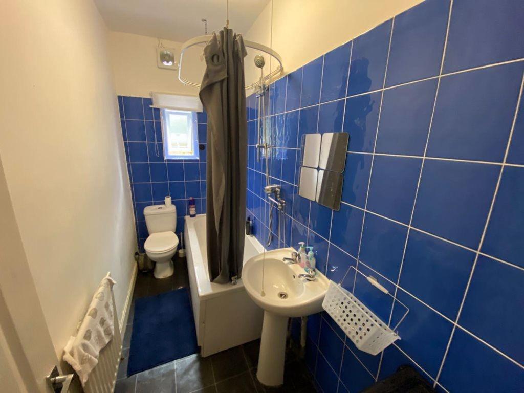 A clean and well-maintained bathroom with a lar...