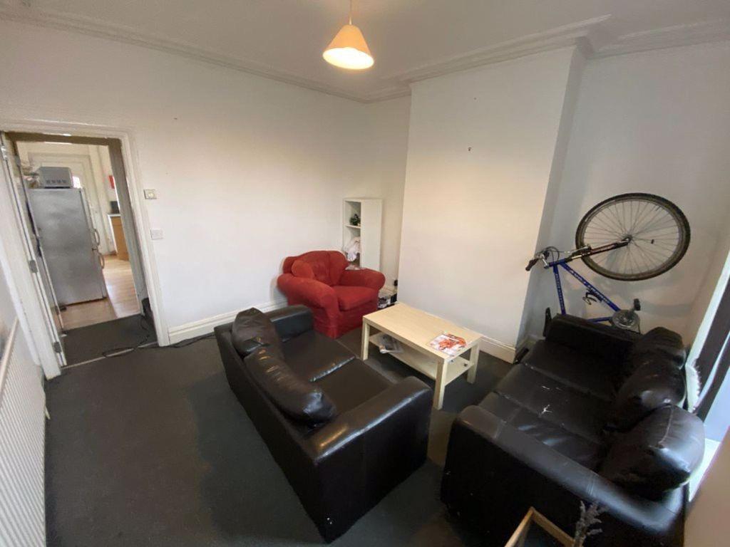 A contemporary living room featuring two sofas,...