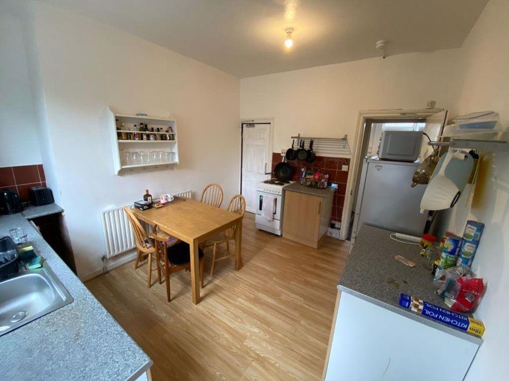 A bright and functional kitchen area with moder...