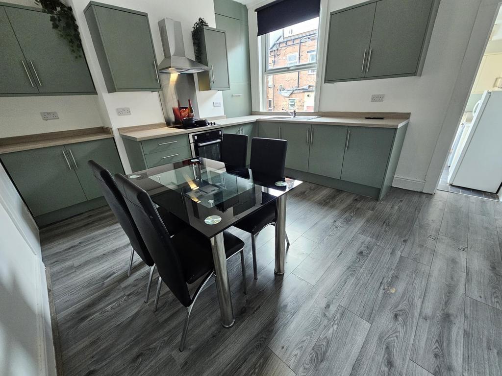 Modern and spacious kitchen with ample storage ...