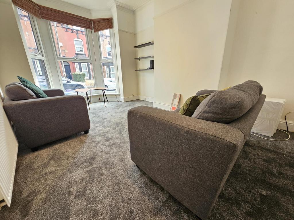 Bright and welcoming living room with large win...