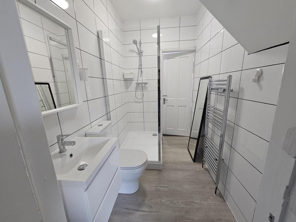 Modern, clean bathroom with a large bathtub and...