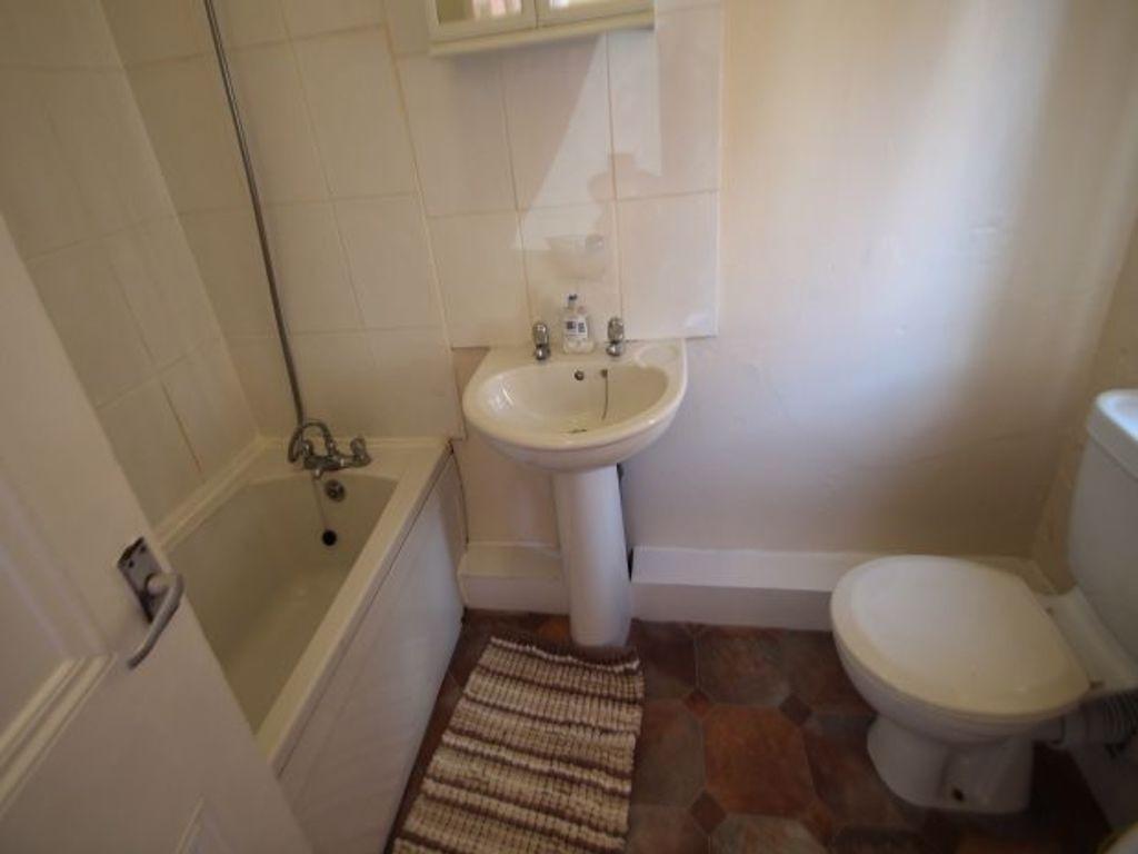 A clean and functional bathroom featuring a bat...