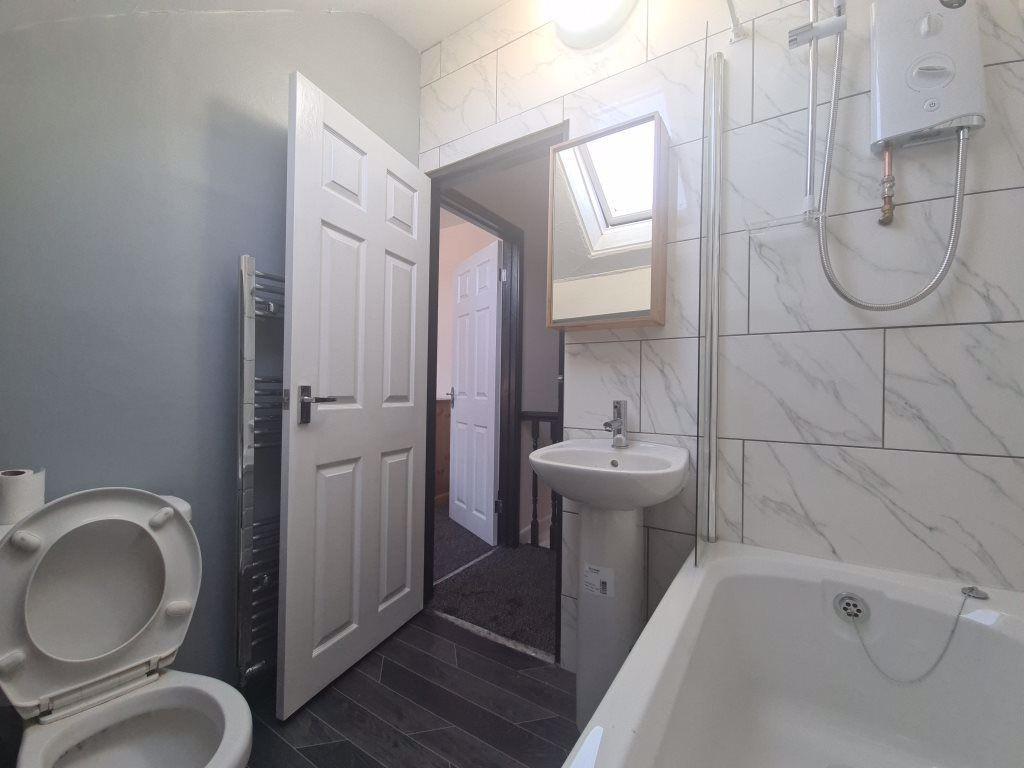 A clean and well-maintained bathroom featuring ...