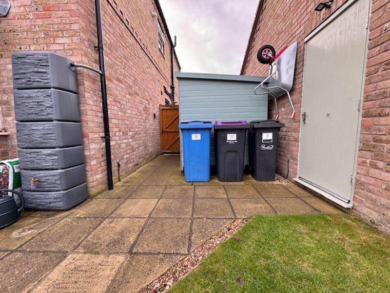 Garage and bin store