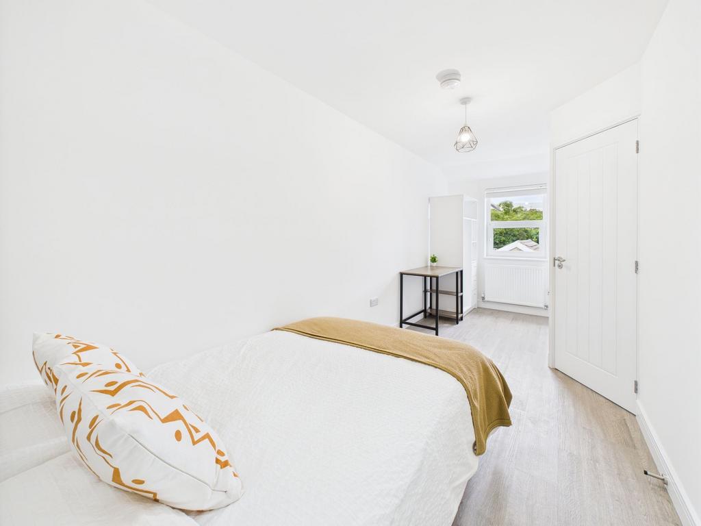 Bright and clean bedroom with a comfortable bed...