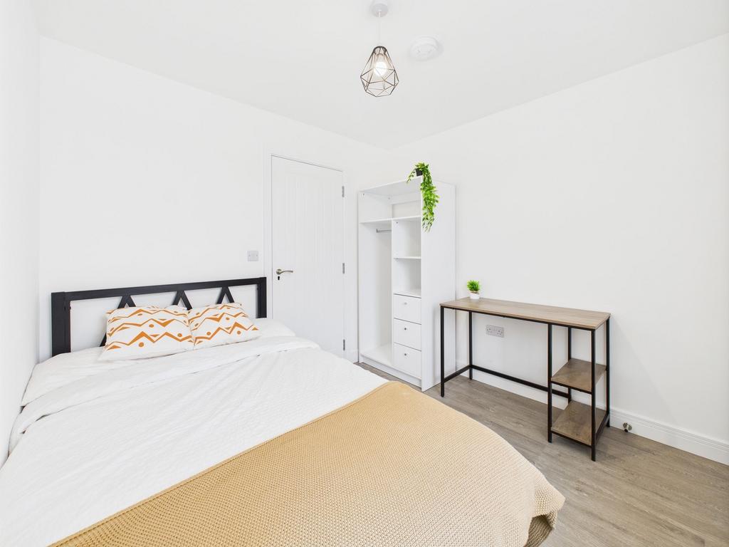 Bright and inviting double bedroom featuring a ...