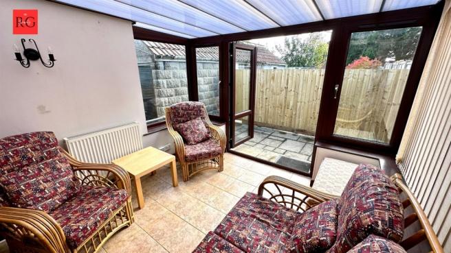 A bright and inviting living room with comforta...