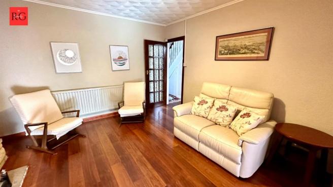 A spacious, well-maintained living room featuri...