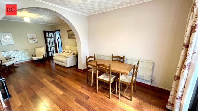 Bright and spacious living area featuring warm ...