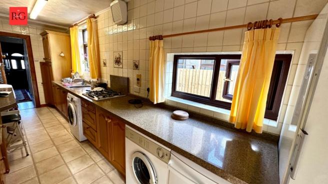 Bright and functional kitchen with ample counte...