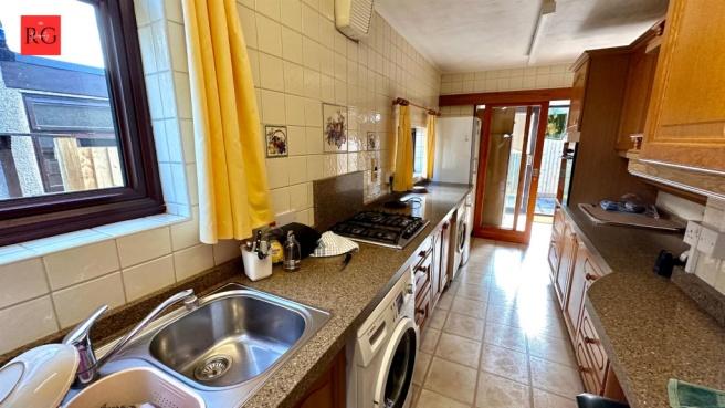 A well-maintained kitchen featuring a double si...