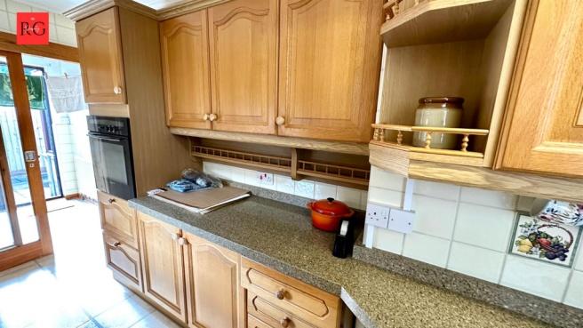 A well-maintained kitchen with ample cabinetry ...
