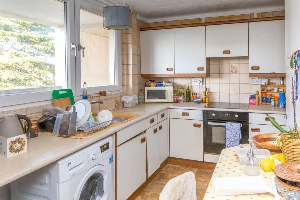 A bright and well-maintained kitchen featuring ...