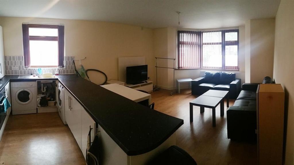 A spacious, well-lit living room with contempor...