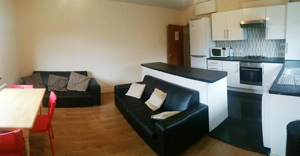 A modern and spacious living room featuring con...