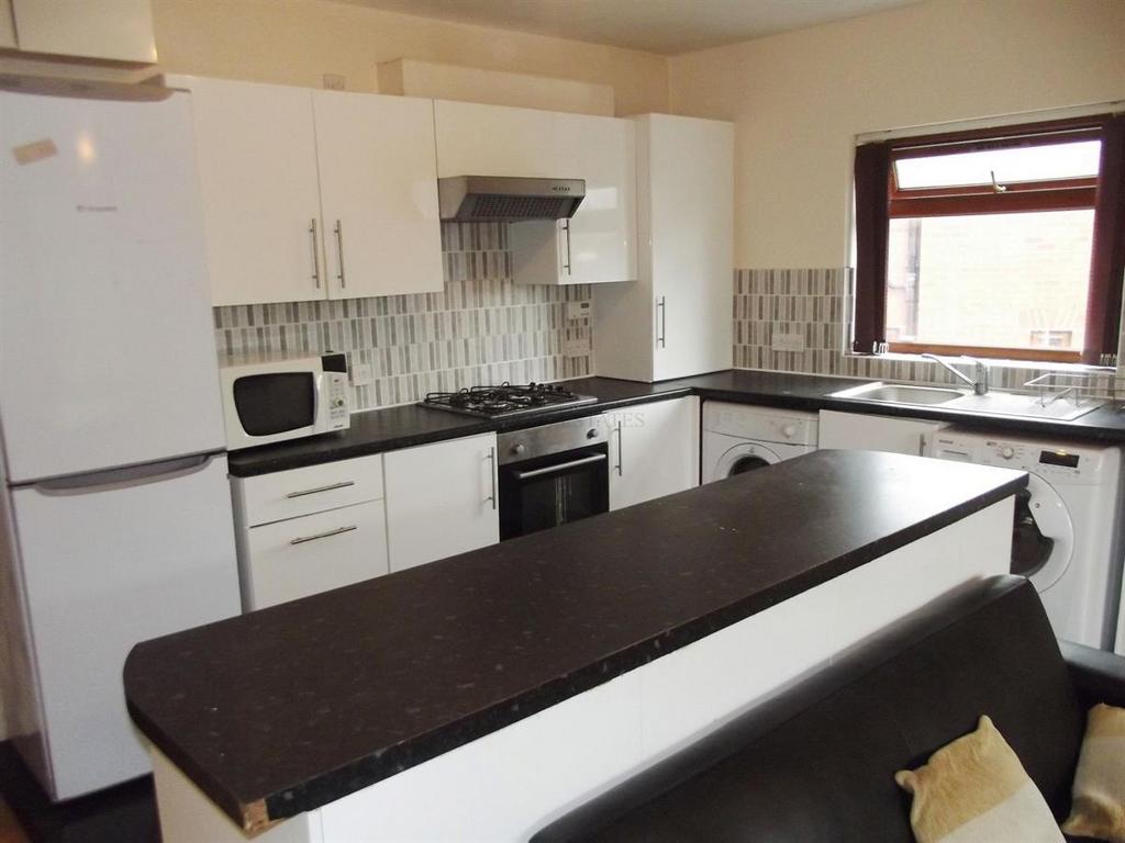 A well-maintained kitchen with clean surfaces, ...