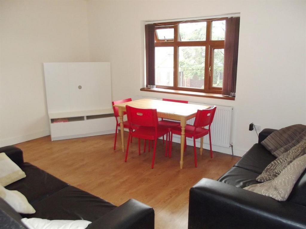 A bright and inviting living room with large wi...
