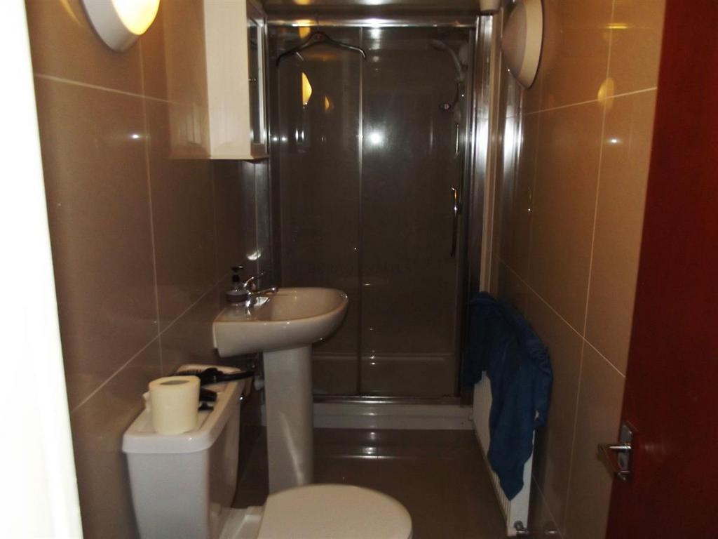 A clean and well-maintained bathroom with a toi...