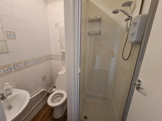 A clean and well-maintained bathroom featuring ...