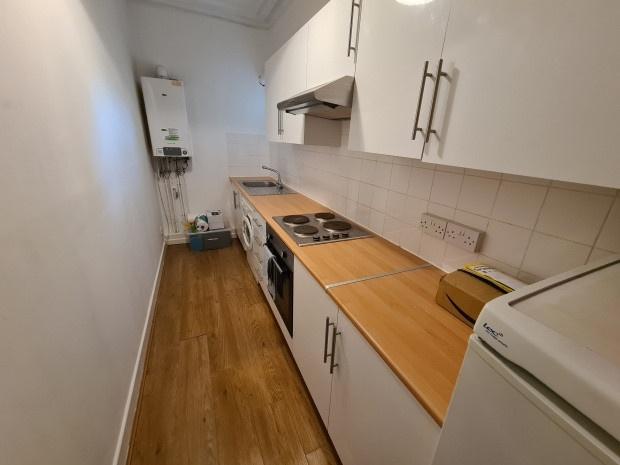 A bright, well-maintained kitchen featuring amp...