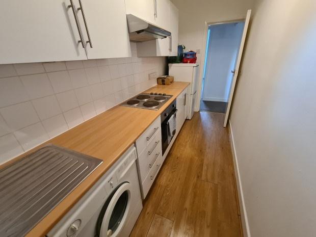 A well-maintained kitchen featuring a wooden wo...