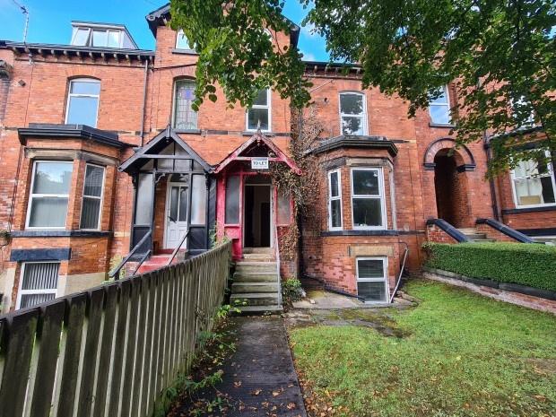 A charming historic brick building with a welco...