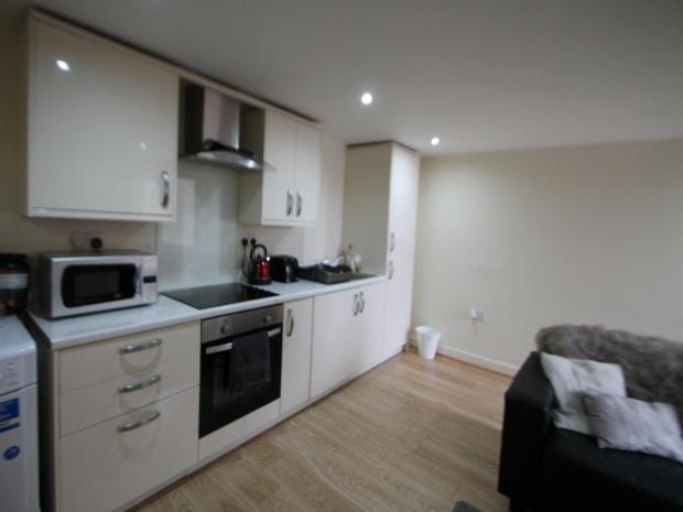 A modern, well-lit living space with ample room...