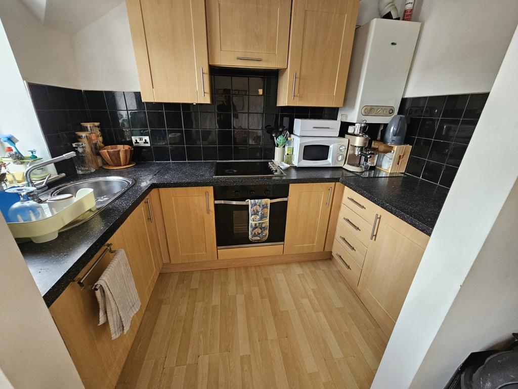 A bright and well-maintained kitchen with ample...