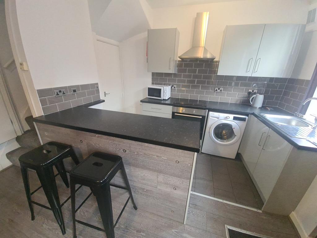 Modern and well-maintained kitchen with ample c...