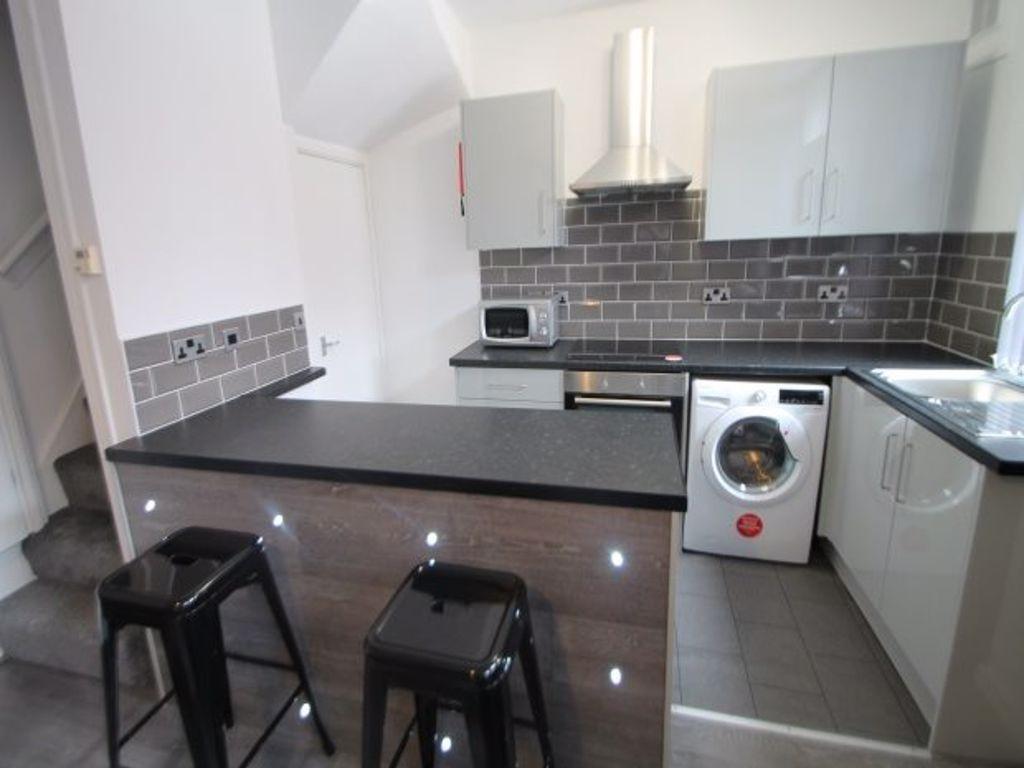 A modern kitchen with a clean, organized appear...