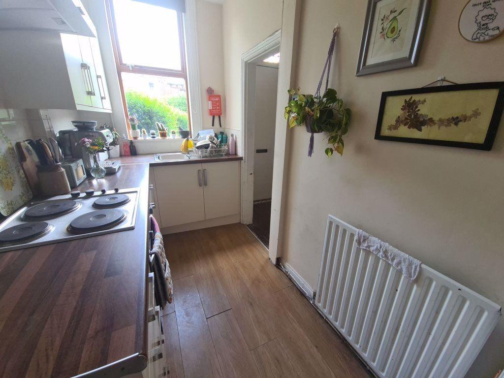 A bright and tidy kitchen area featuring a coun...