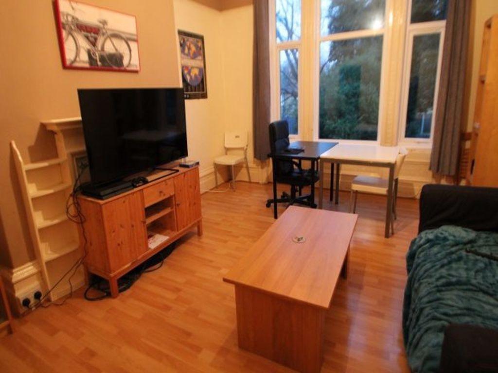 A spacious and welcoming living room featuring ...