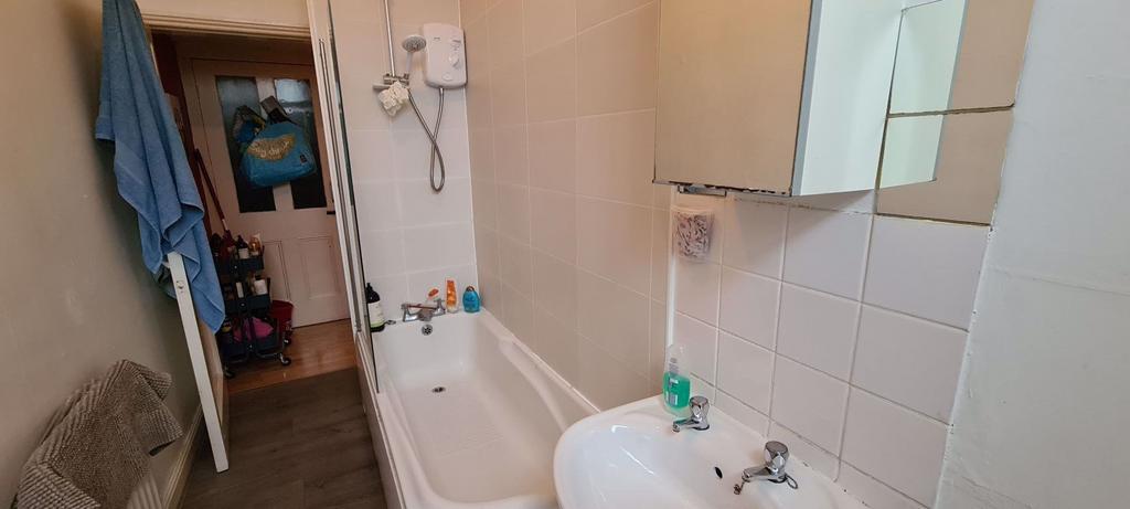 A clean and well-maintained bathroom featuring ...