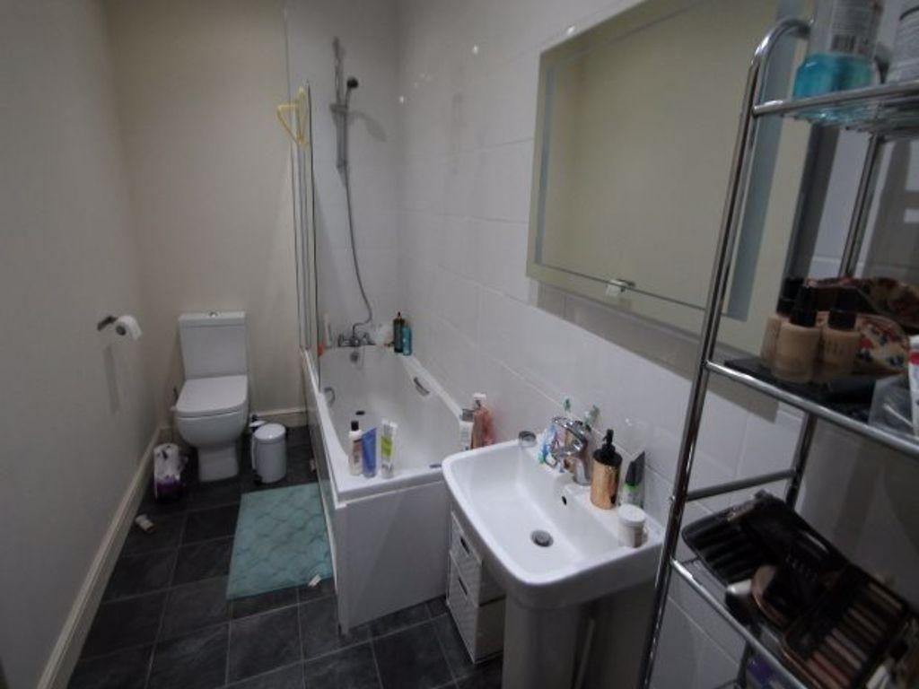 A clean and well-maintained bathroom featuring ...
