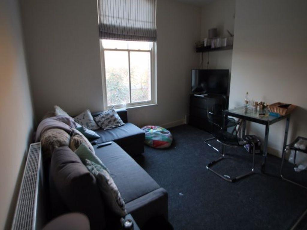 A cozy living room featuring a sectional sofa, ...