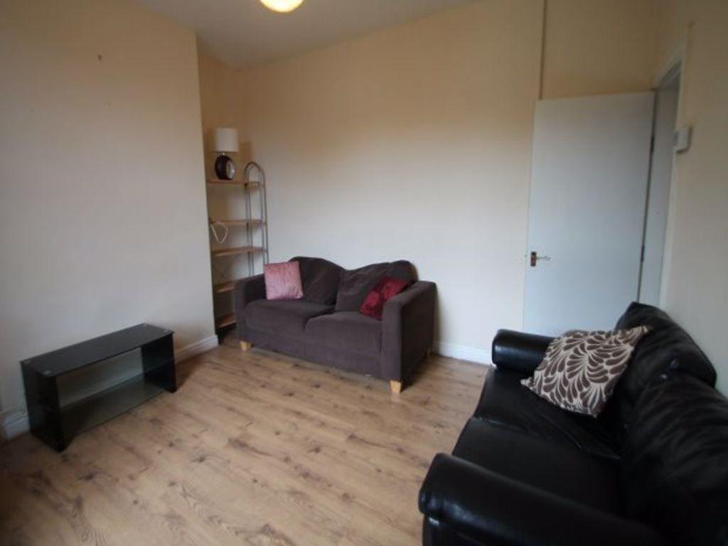 A spacious and welcoming living room featuring ...