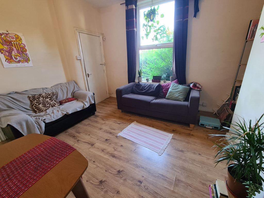 Bright and welcoming living room featuring comf...