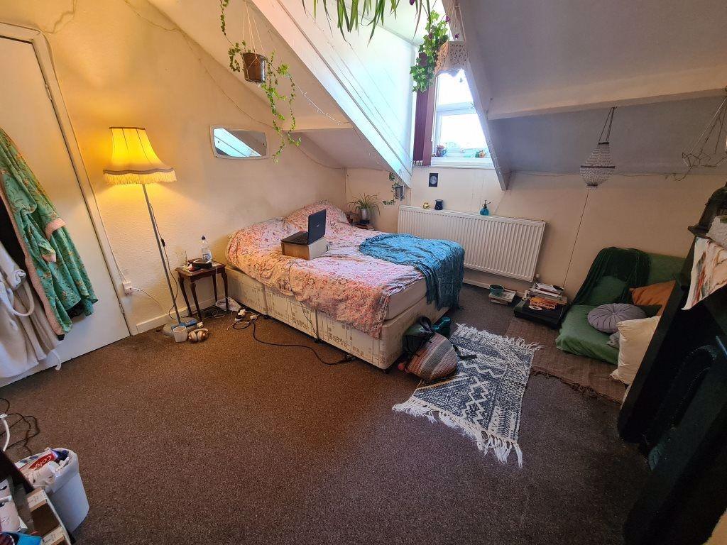 Spacious master bedroom featuring ample space a...