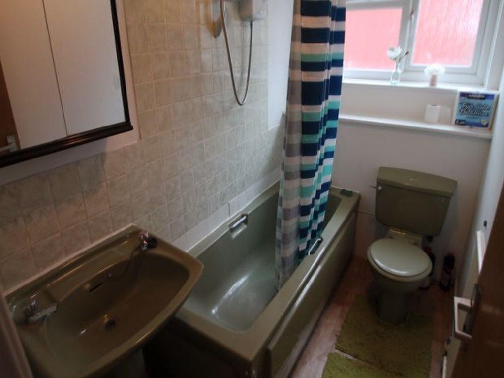 A clean and well-maintained bathroom featuring ...