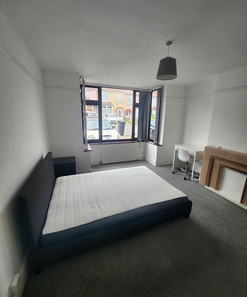 Spacious bedroom featuring a large window that ...