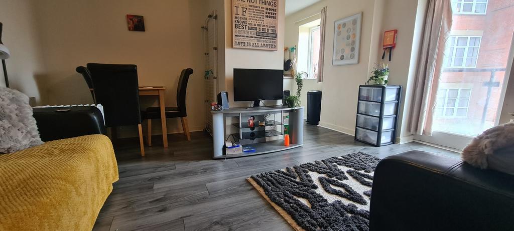 A spacious and inviting living room filled with...