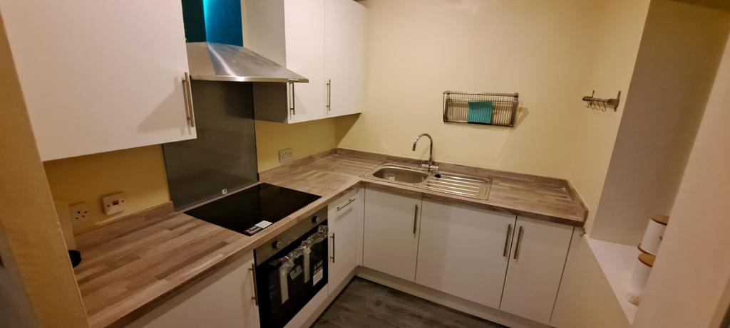 A modern kitchen area showcasing ample counter ...