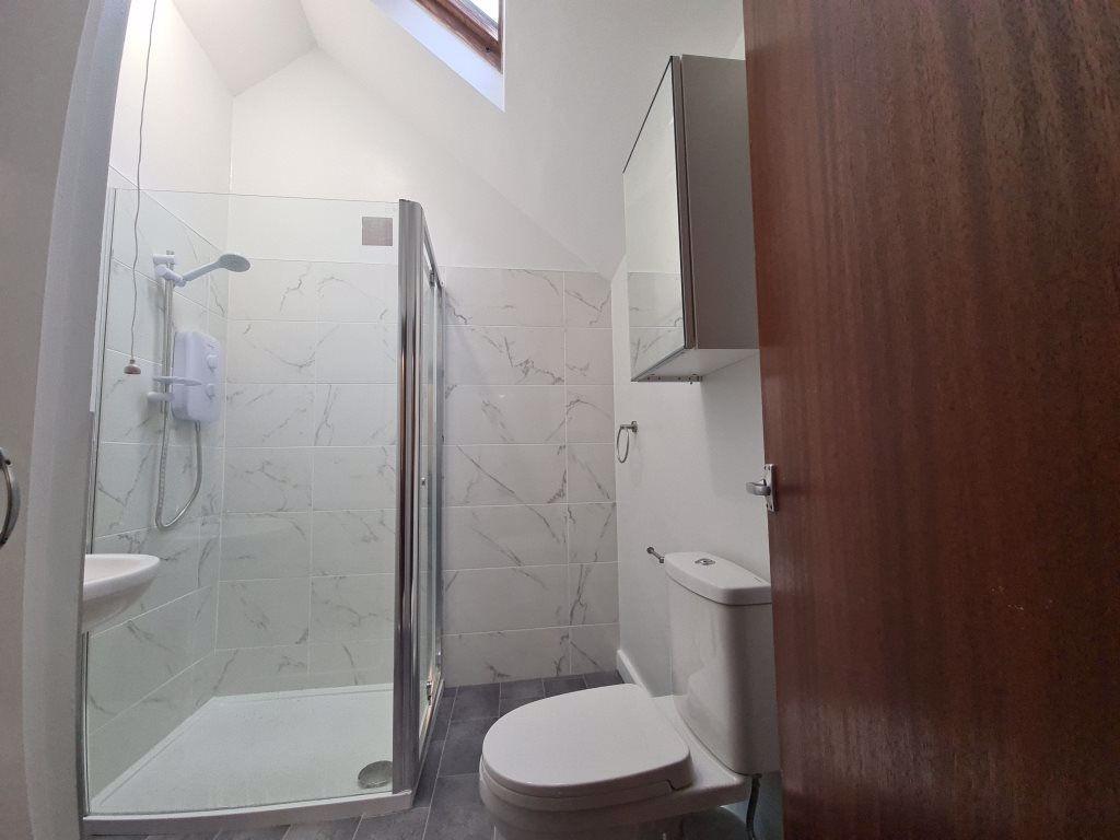 Bright and modern bathroom featuring a spacious...