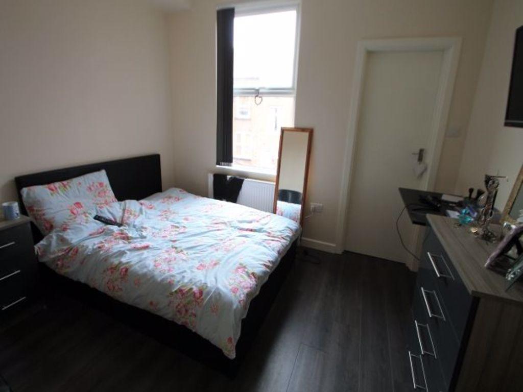 A spacious and well-maintained master bedroom f...