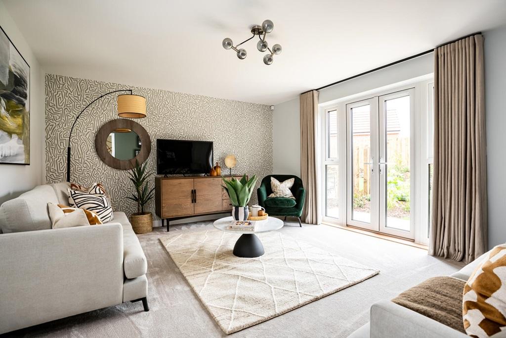 Open plan lounge with French doors opening to...