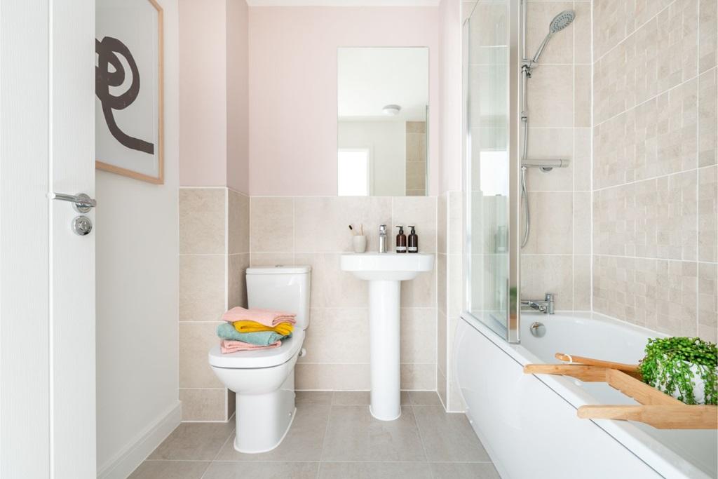 The relaxing family bathroom serves both bedrooms