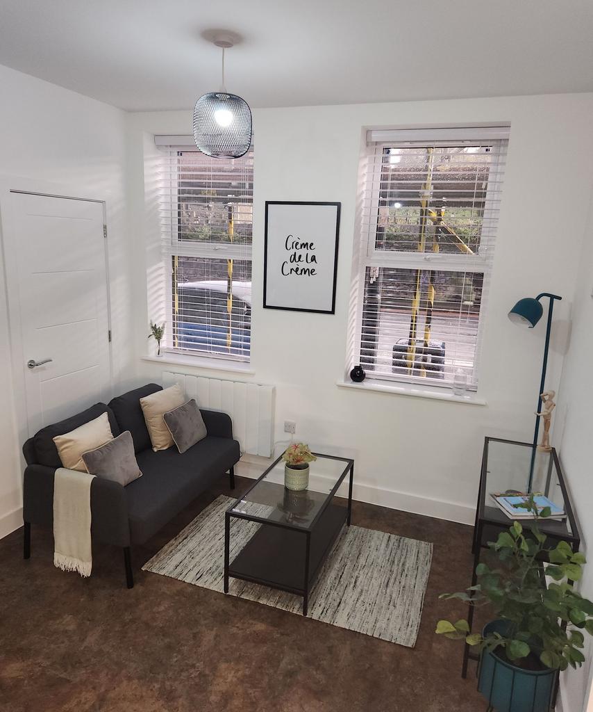 A bright and inviting living room featuring a m...