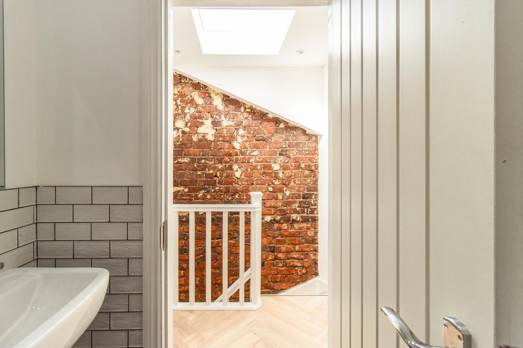 Bright and clean bathroom featuring a white sin...